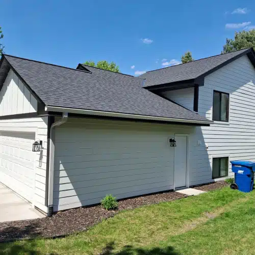 Modern asphalt shingle roof and siding on suburban home representing roofing terms Minnesota by Wright at Home Roofing & Exteriors in Minnesota