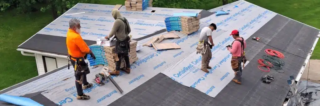Roofing crew installing underlayment and shingles, illustrating roofing terms Minnesota by Wright at Home Roofing & Exteriors in Minnesota