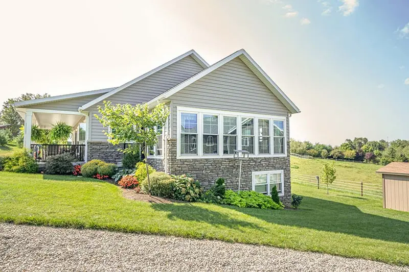 One-story house with light gray horizontal siding, recently installed by a siding contractor in Minneapolis, MN