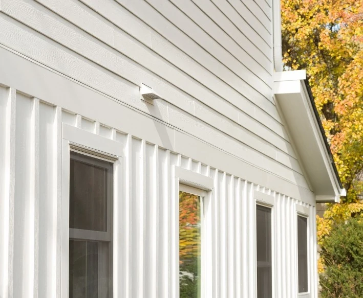 House with white James Hardie fiber cement siding and multiple windows in Minneapolis, MN