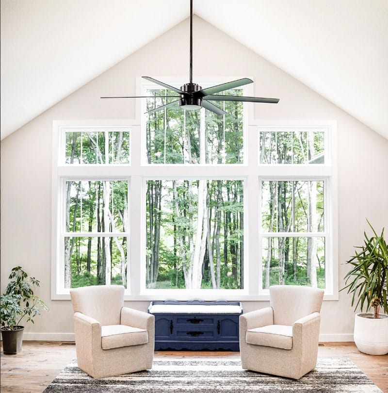 A bright, spacious room features large ProVia windows with a forest view Wright at Home Roofing & Exteriors Minneapolis, MN 