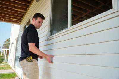 Wright at Home Roofing & Exteriors siding contractor in the process of siding replacement in Minneapolis, MN