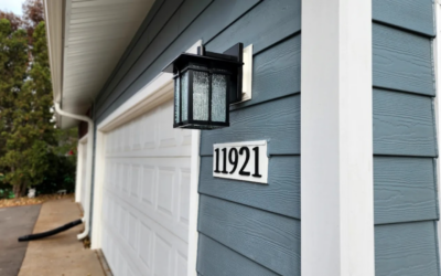 House with blue siding and white garage door made by siding contractor in Minneapolis, MN