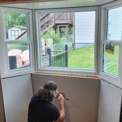 Wright at Home Roofing & Exteriors window contractor in a process of windows replacement in Minneapolis, MN