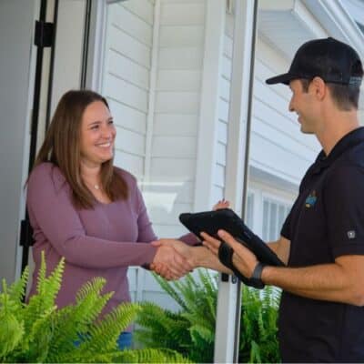 Wright at Home Roofing & Exteriors siding contractor with a client, choosing exterior design options in Minneapolis, MN