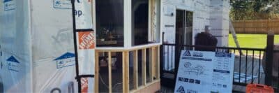 Light gray Hardie Plank lap siding on a two-story house, with dark gray trim and black windows by window contractor in Minneapolis, MN