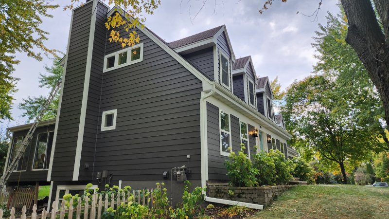 Completed siding project featuring Rich Espresso Hardie planks and Arctic White trim in Eden Prairie, MN by Wright at Home Roofing & Exteriors
