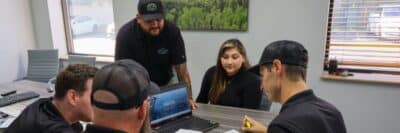 Team collaboration meeting at Wright at Home Roofing & Exteriors in Minneapolis, MN during off-season planning
