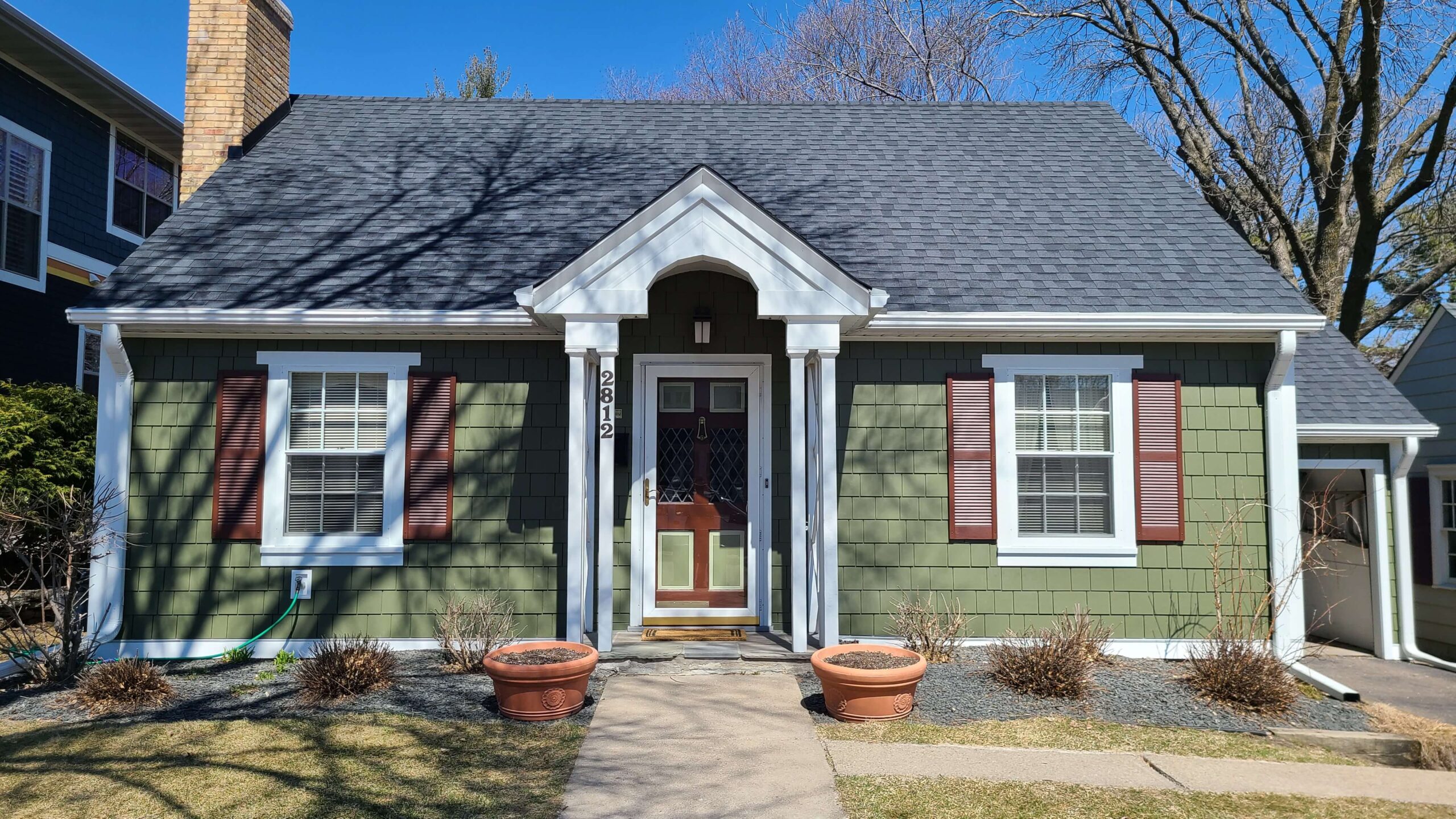 Home with James Hardie shingle siding in Mountain Sage and CertainTeed Moire Black roof by Wright at Home Roofing & Exteriors in Minneapolis