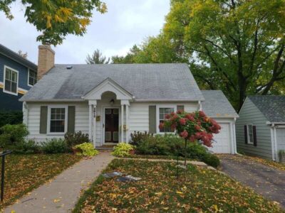 Front view of house before James Hardie siding and CertainTeed roof installation by Wright at Home Roofing & Exteriors in Minneapolis