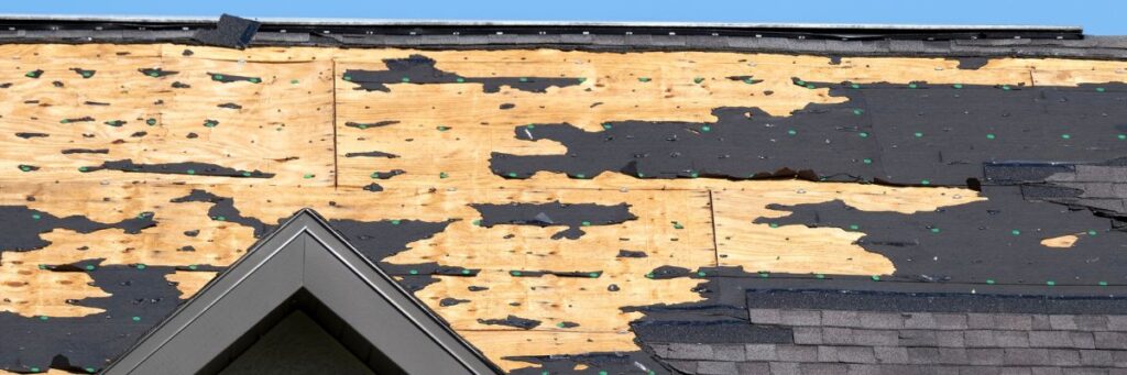 Exposed and damaged roof sheathing caused by spring storm weather, prepared for repair by Wright at Home Roofing & Exteriors in Minneapolis