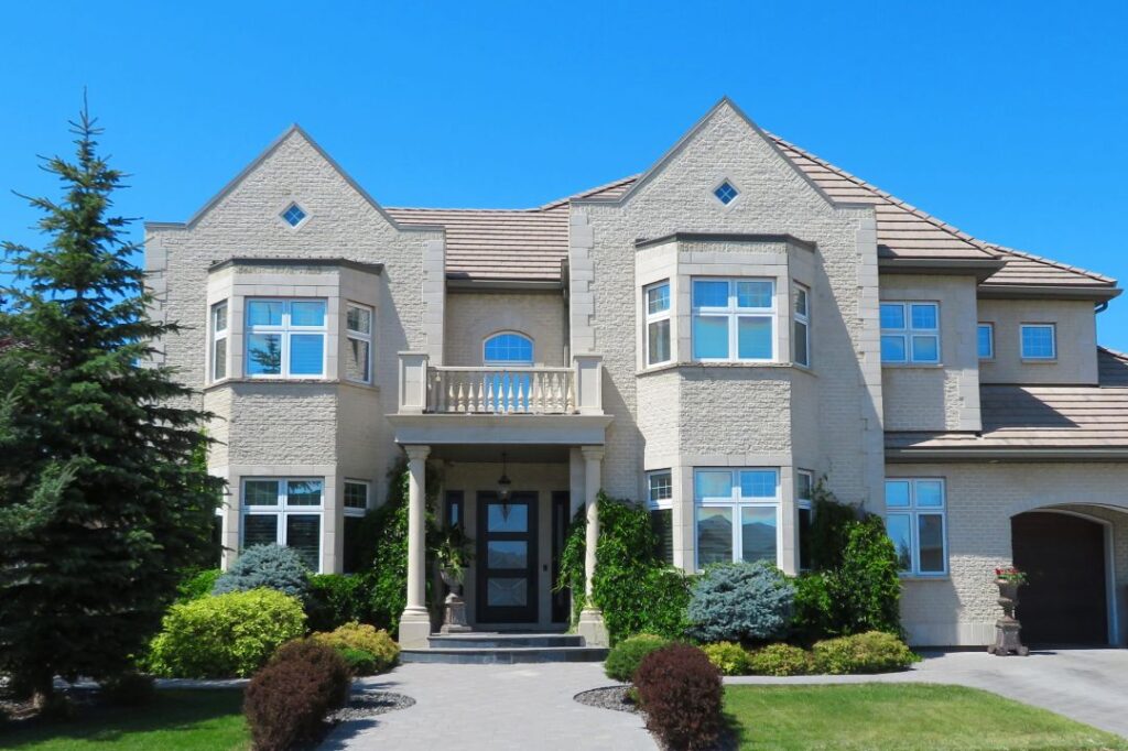 A large home with new windows following a window replacement Wright at Home Roofing & Exteriors in Minneapolis, MN