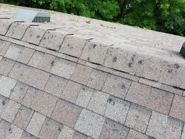 Severe roof damage with missing or broken shingles
