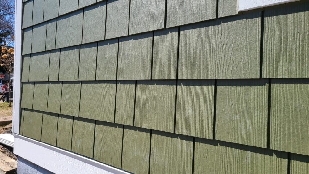 Detailed view of James Hardie shingle siding in Mountain Sage by Wright at Home Roofing & Exteriors in Minneapolis