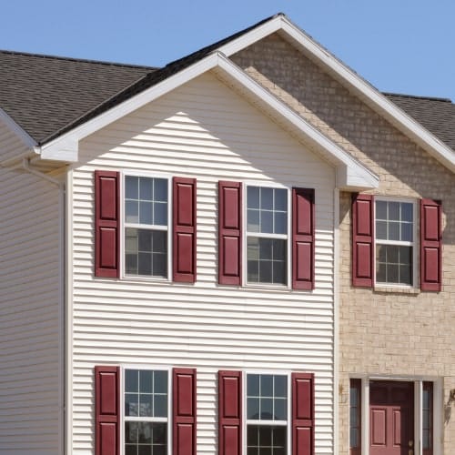 White Vinyl Siding with red shutters Wright at Home Roofing &amp; Exteriors in Minneapolis, MN