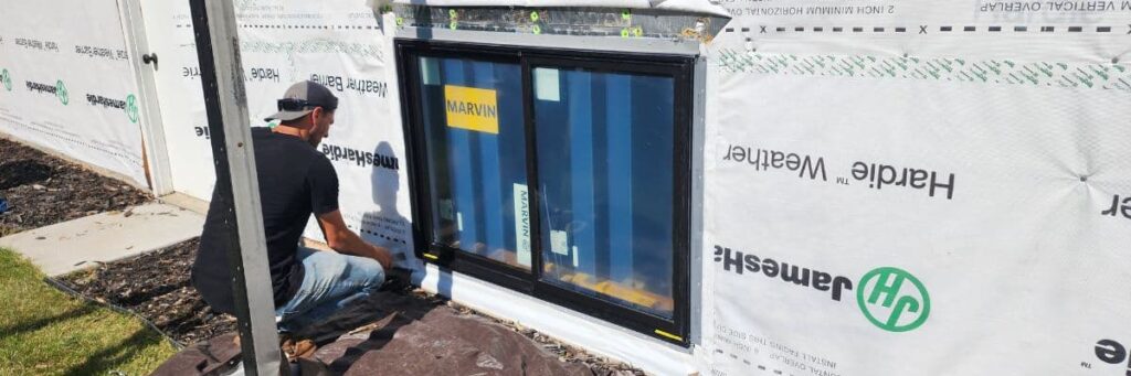 Wright at Home Roofing & Exteriors crew in a process of window replacement in Minneapolis, MN