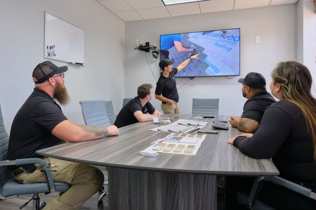 Insurance agent explaining impact-resistant shingles vs regular shingles coverage