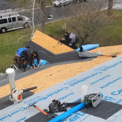 Roofing contractor Minnesota crew installing new roof decking and synthetic underlayment on a Minneapolis home for Wright at Home Roofing & Exteriors