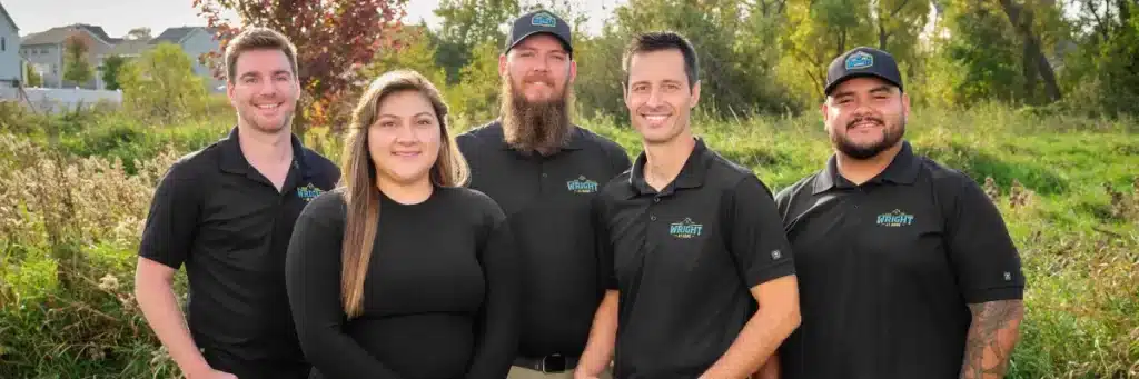 Melissa Villa smiling with the Wright at Home Roofing & Exteriors team in Minneapolis, MN