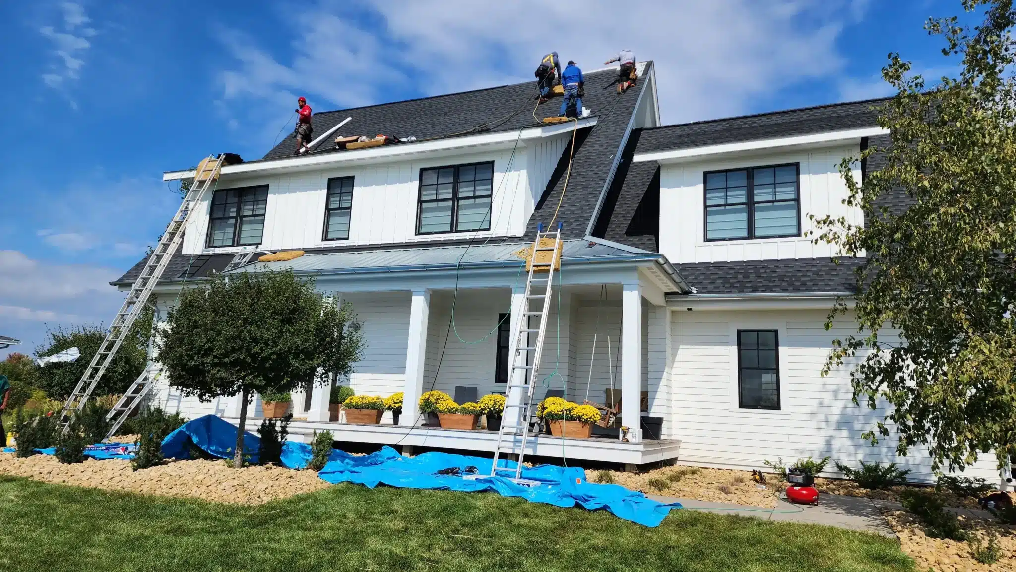 Roofing team working on a beautiful two-story home in Minneapolis, highlighting Wright at Home Roofing & Exteriors’ Referral Rewards program