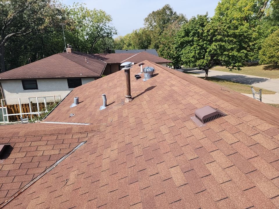 New asphalt shingle roof with vents installed by Wright at Home Roofing & Exteriors in Crystal