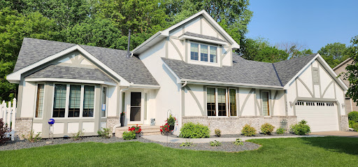 Residential home with new roof installation by Dolan Roofing & Construction in Robbinsdale, MN
