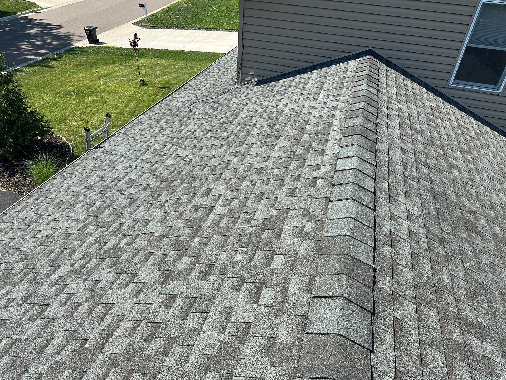 Finished residential roof replacement showing clean shingle pattern and expert finish by Wright at Home Roofing & Exteriors in New Hope