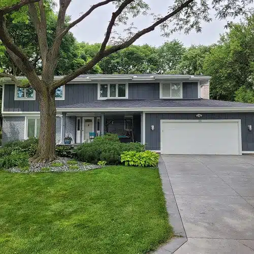 Residential home with newly inspected clean roof by Wright at Home Roofing & Exteriors in MN