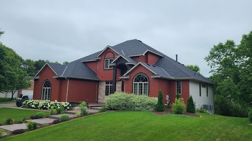 Beautiful residential home with newly installed roof by Wright at Home Roofing & Exteriors in Crystal