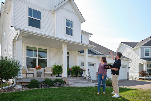 Homeowner consulting with roofing professional