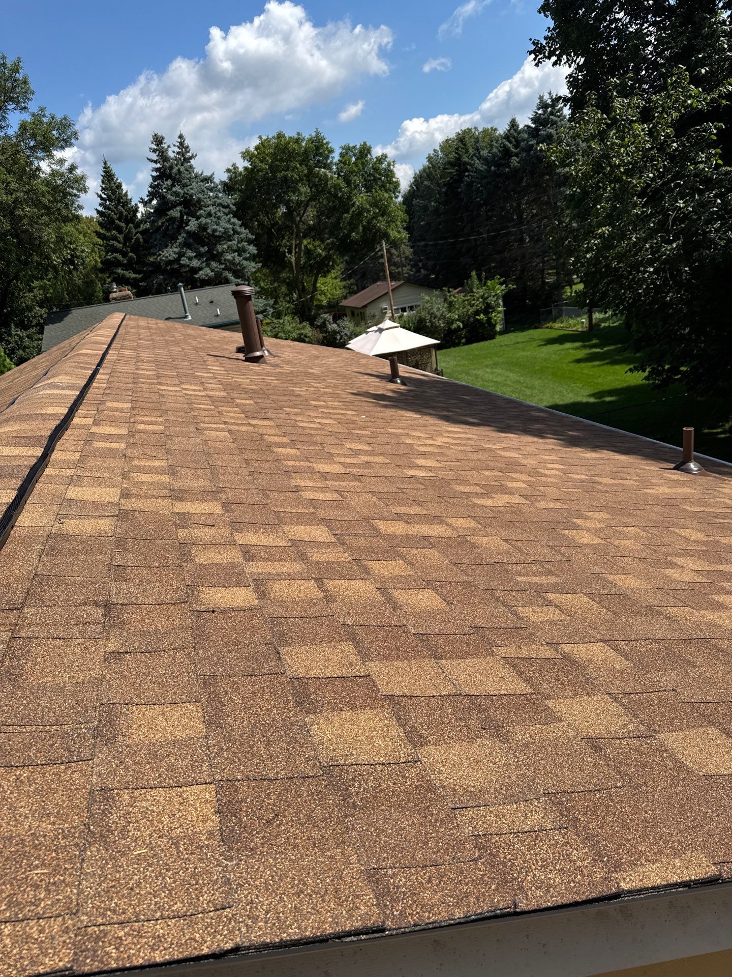 New asphalt shingle roof installation by Wright at Home Roofing & Exteriors in Maple Grove