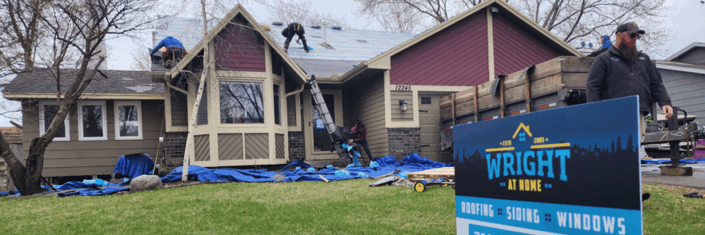 Crew performing roof replacement under lifetime warranty with Wright at Home Roofing & Exteriors in Minneapolis