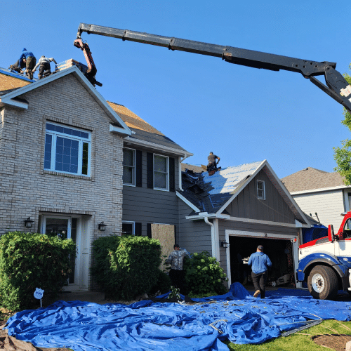 Homeowner reviewing roof replacement cost calculator results in Minneapolis by Wright at Home Roofing & Exteriors