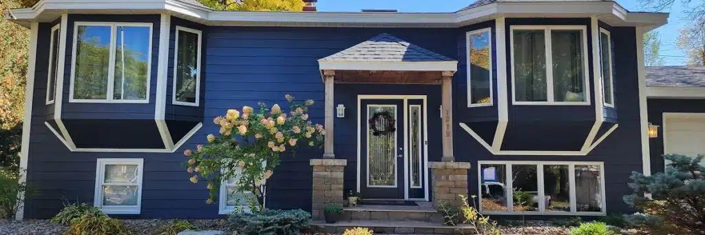 Full view of Stillwater MN exterior restoration project with James Hardie siding and new roofing by Wright at Home Roofing & Exteriors in MN