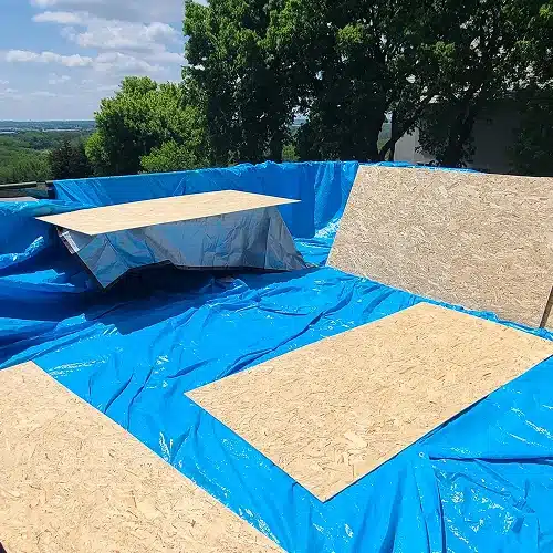 Eden Prairie roof replacement preparation with plywood and protective tarp by Wright at Home Roofing & Exteriors in MN