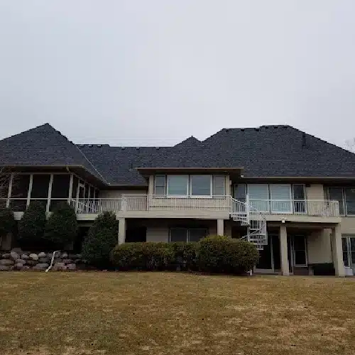 Large modern home roof installation using durable materials by Wright at Home Roofing & Exteriors in Shoreview