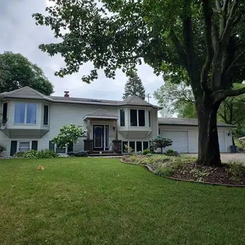 Original Stillwater MN home exterior before James Hardie siding and roofing upgrades by Wright at Home Roofing & Exteriors in MN