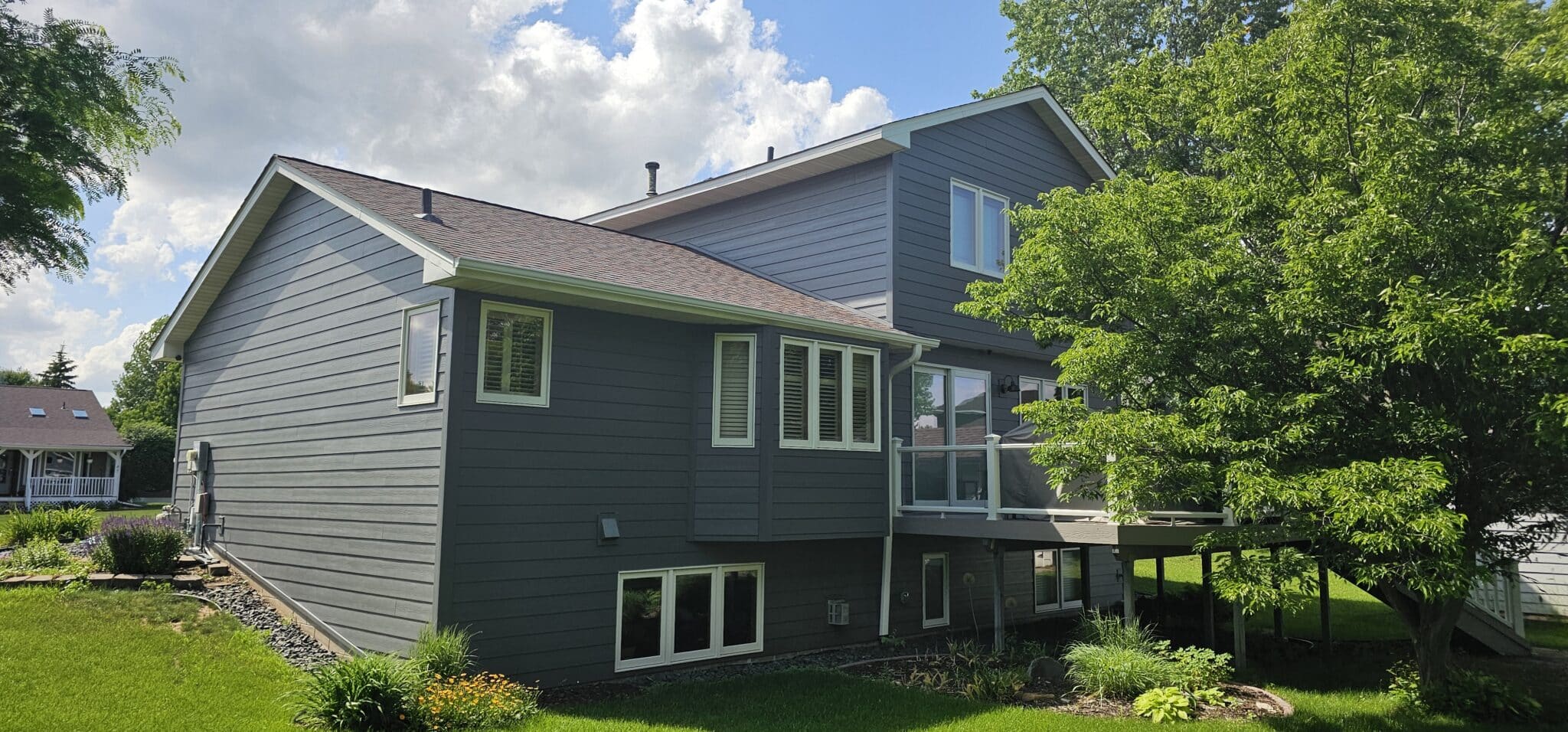 Modern two‑story home exterior remodel in Blaine MN by Wright at Home Roofing & Exteriors