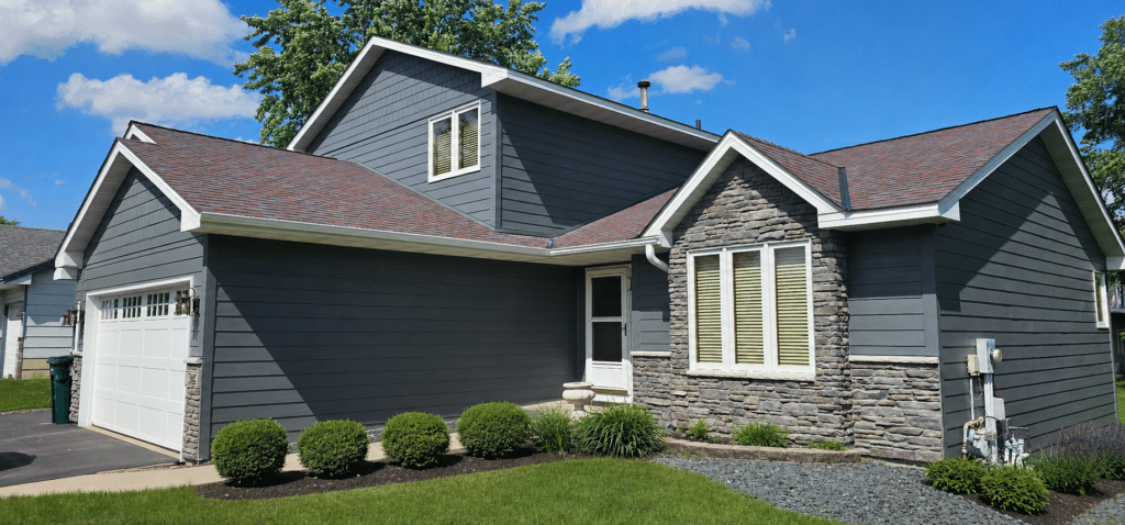 Modern dark gray siding and stone veneer exterior remodel Blaine MN by Wright at Home