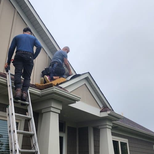 Roofing crew working on a home, best roofing materials for Minnesota roofing installation in Blaine, MN by Wright at Home Roofing & Exteriors